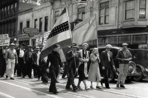Communist Party members march down J Street.